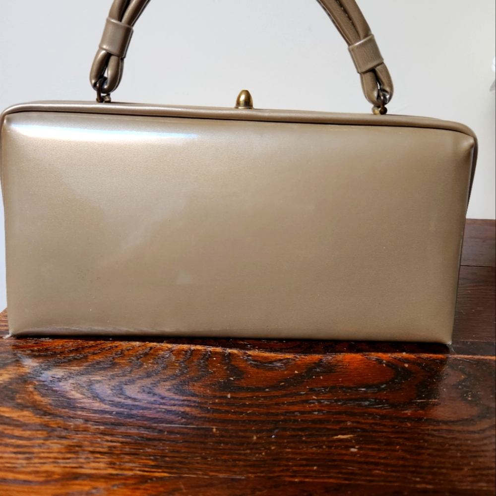 Vintage Purse. Soft tan color. Looks very shear. Medium to small size purse.